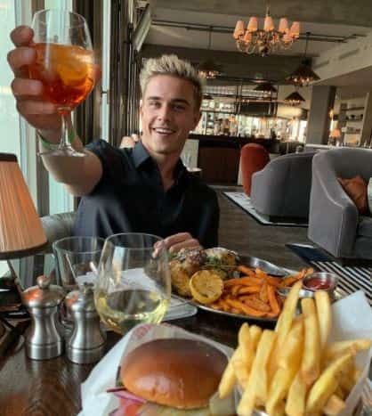 Hendrik Giesler enjoying his food and wine. 